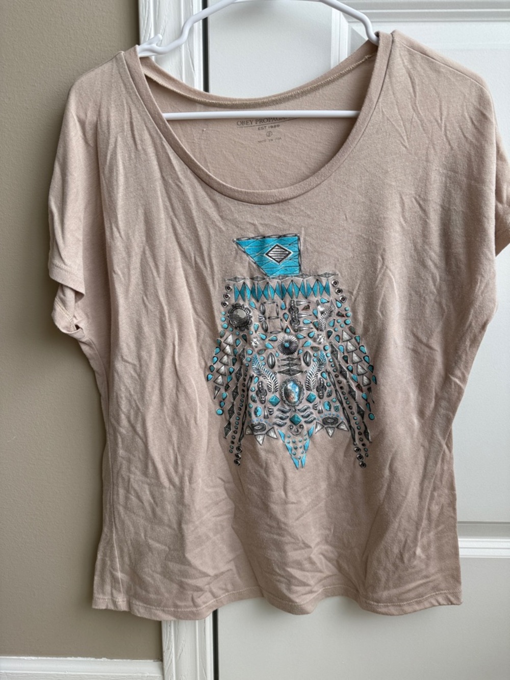 Women’s Obey Beige Graphic Tee with Turquoise Embellishment